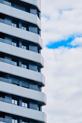 Modern apartment building with balconies and terraces.