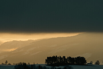 Morning light of Toten, Norway, seen from Tømmerholshøgda towards the Totenåsen Hills.