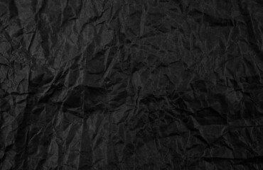 Black crumpled paper texture pattern. Rough grunge old blank.