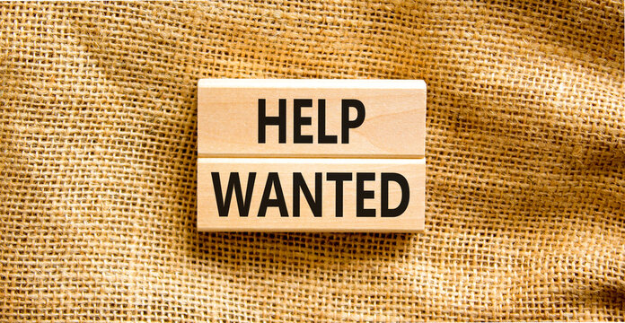 Help wanted and support symbol. Concept words Help wanted on wooden blocks on a beautiful canvas table canvas background. Business support and help wanted concept, copy space.