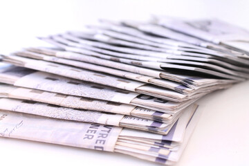 Bundles of Danish kroner money bills on white background