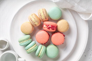 Colorful and delicious macaroons with berry fruits flavor.