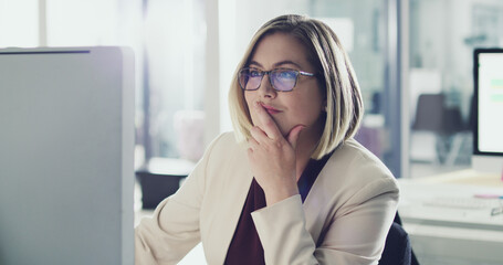 She always thinks before she acts. Cropped shot of an attractive businesswoman working on her...