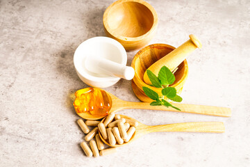 Alternative medicine herbal organic capsule with vitamin E omega 3 fish oil, mineral, drug with herbs leaf natural supplements for healthy good life.