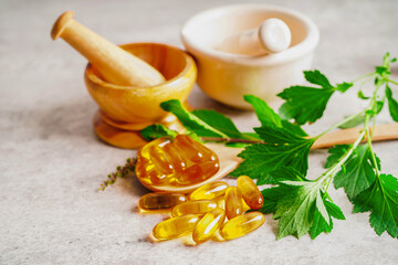 Alternative medicine herbal organic capsule with vitamin E omega 3 fish oil, mineral, drug with herbs leaf natural supplements for healthy good life.