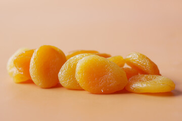  apricot fruit on orange background close up 
