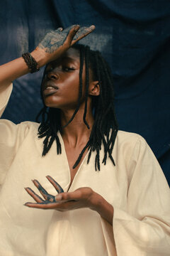 Portrait of a young african indigo eco fashion designer