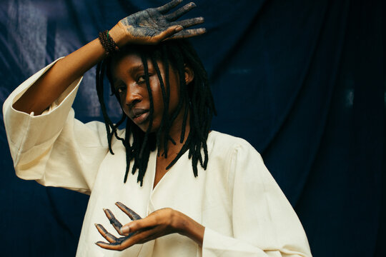 Portrait of a young african indigo eco fashion designer