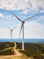 Turbines in a mountain wind farm. Ecological energy production.