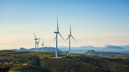 Fototapeta Turbines in a mountain wind farm. Ecological energy production. obraz