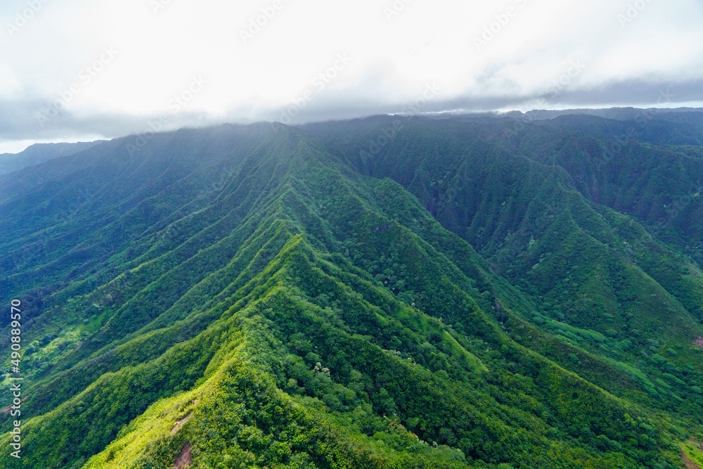 Poster scenic view of a mountain landscape in hawaii under a sky