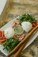 Image of portion of food. Portion with cheese, tomatoes, olive and vegetables