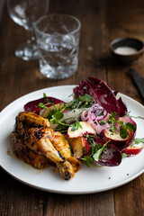 Roast poussin with radicchio and peach salad