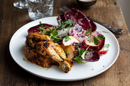 Roast poussin with radicchio and peach salad