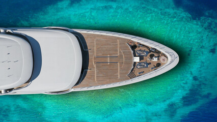 Obraz premium Aerial drone top down photo of luxury exotic yacht nose with wooden deck anchored in paradise turquoise bay