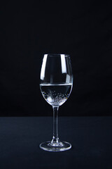 glass of champagne isolated on black background