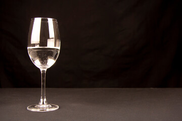 glass of champagne isolated on black background