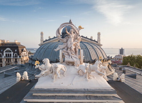 Roof statue of Opera and Ballet Theater Odesa Ukraine sightseeing. Aerial photography. Top view. Space for text. Statue of Greek goddess Melpomene in a chariot drawn by four panthers.