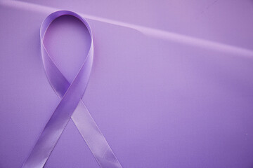 Purple ribbon for Purple Day - World Epilepsy Day, March of 26. Symbol of Epilepsy Day on purple background with shadows