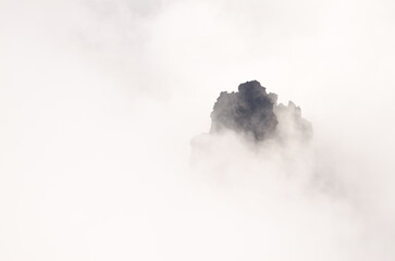 Rocky cliff in the fog. Caldera de Taburiente National Park. La Palma. Canary Islands. Spain.