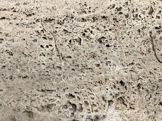pitted polished stone surface