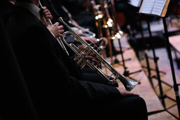 Wind musical instruments. Notes in front of the musicians of the symphony orchestra.