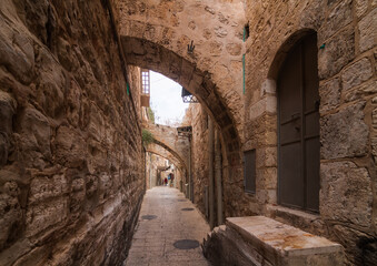 Fototapeta na wymiar Jerusalem Old City narrow streets with beautiful arches