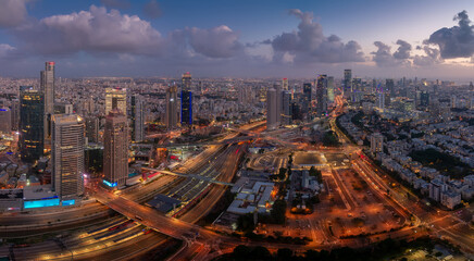 Tel Aviv big evening aerial panorama. Tall modern buildings, highways and living areas