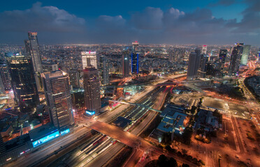 Fototapeta na wymiar Tel Aviv night view from above. Aerial panorama. Tall modern buildings