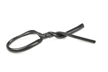 Black plastic coated wire tie used for a variety of things isolated on white background.