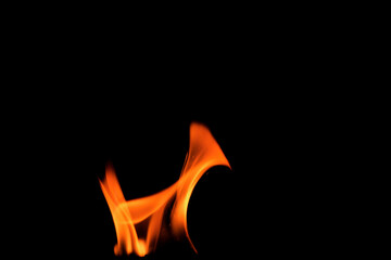 Close up burning flames on black background for graphic design or wallpaper