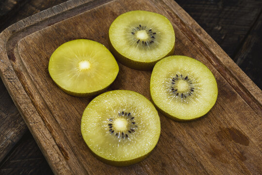 Healthy food golden kiwi fruit on wood background.