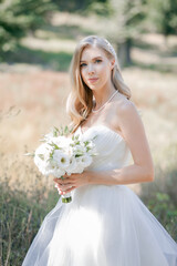 Stylish, elegant, tender blonde bride. Bridal bouquet