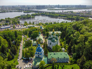 Kyiv, Ukraine. View to a monastery Vydubitsky and Dnieper River. Aerial drone view. - 490910509