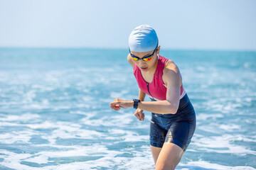 woman training triathlon at beach