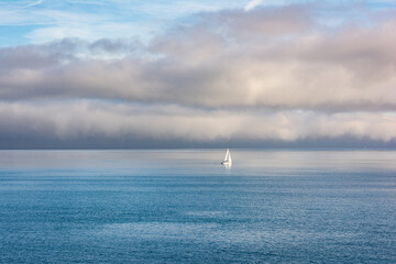 Fototapeta premium Sail boat in the middle of the sea, Antibes, France 