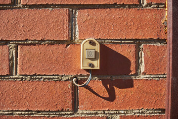 old bell on a brick wall