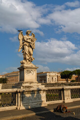 Rome, Italy - June 2000: A stone statue of an angel on a blue sky background