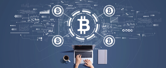 Bitcoin theme with person working with a laptop