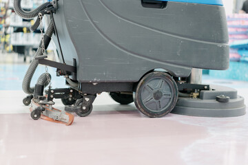 cleaning floor with machine	
