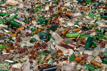 glass bottles of beer, wine, syrups, in an old dump of an abandoned municipality in the Canary...