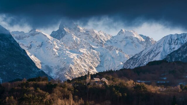 Ecrins National Park with Olan Peak and the village of Chauffayer in Champsaur-Valgaudemar Valley. Sunrise time lapse with passing clouds. Hautes-Alpes (Alps), France