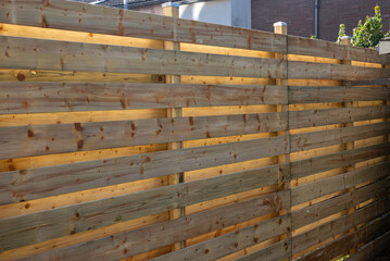 New wooden build fence in a garden in Hoofddorp The Netherlands after storm damage taken by storm...