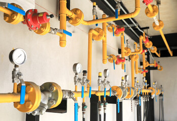 Yellow gas pipeline system installed on building wall.