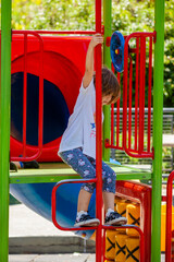 little girl on the playground in the park