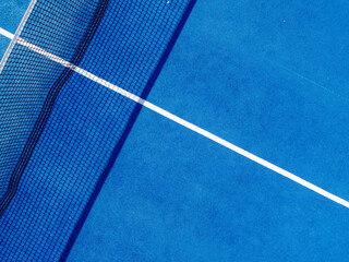 Aerial view of a net and a part of a paddle tennis court