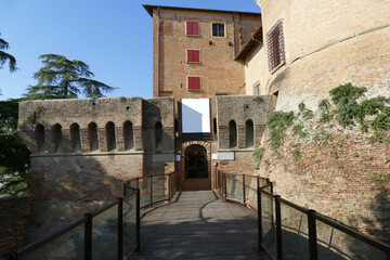 Sforza Fortress in Dozza,  the wooden drawbridge with chains over the moat in front of the main entrance door