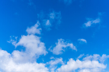 Naklejka na ściany i meble White clouds in front of a blue sky