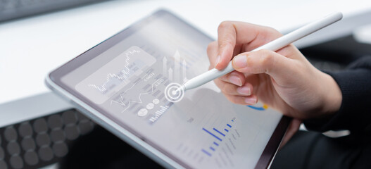 close up businesswoman use stylus on tablet to working about planning business strategy ,...