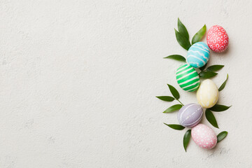 Colorful Easter eggs with spring flower leaf isolated over white background. Colored Egg Holiday border